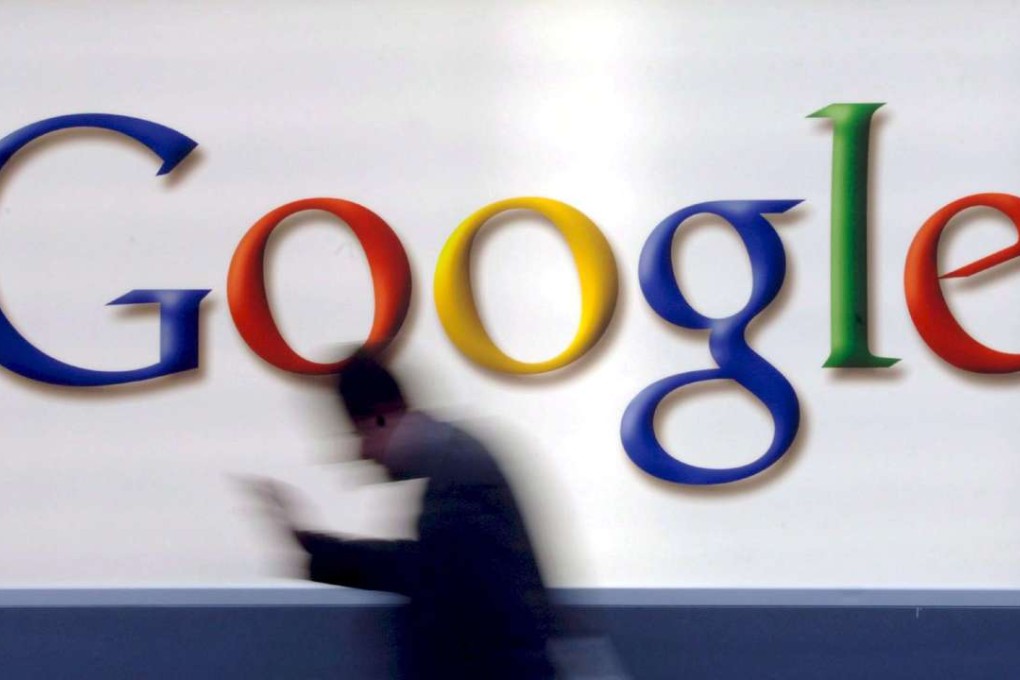 A man passes by a Google logo in Frankfurt, Germany. Photo; EPA, Boris Boessler.
