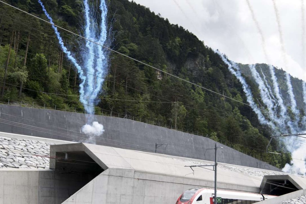 The first train comes out of the Gotthard tunnel’s North portal. Photo: AP