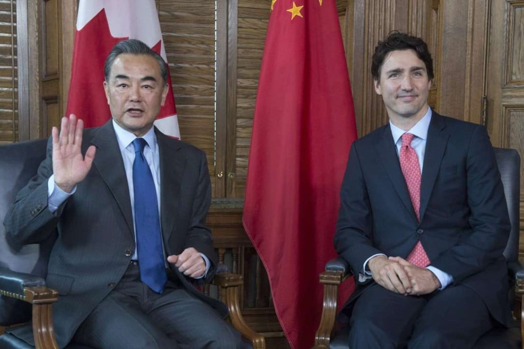 China’s Foreign Minister Wang Yi pictured with Prime Minister Justin Trudeau during his trip to Canada. Photo: AP