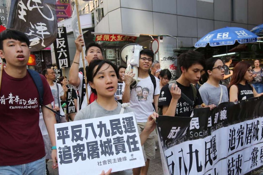 Demonstrators recalling the 1989 Tiananmen Square crackdown marching in Wan Chai on Sunday. Photo: Edward Wong