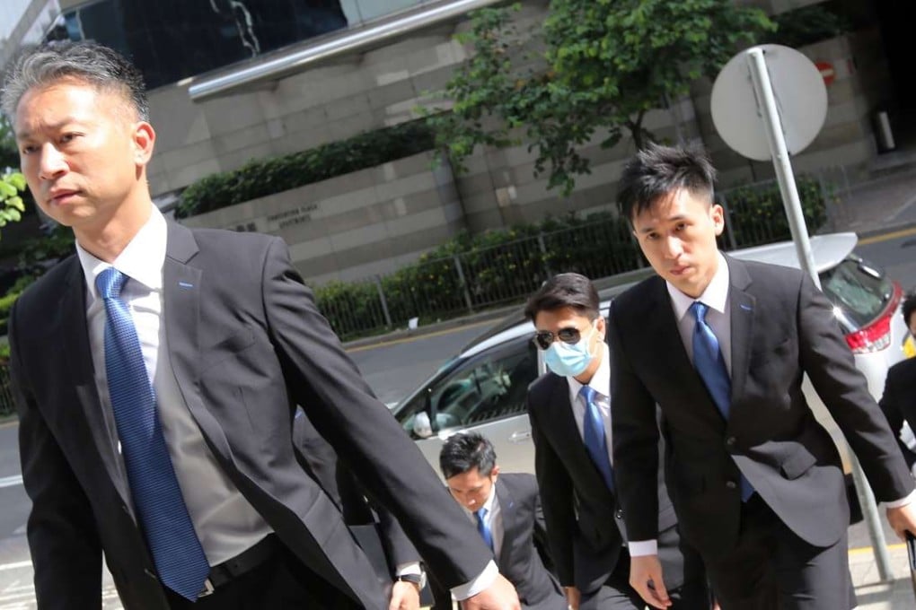 The accused police officers arriving at the District Court in Wan Chai on Friday. Photo: Edward Wong