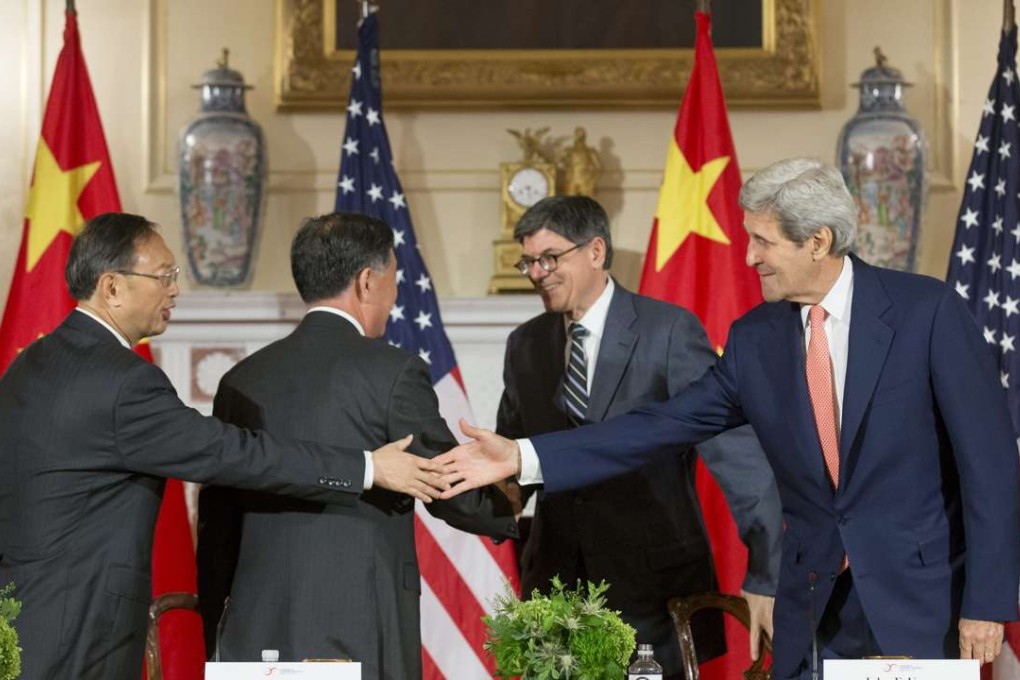 US Secretary of State John Kerry (right) and US Treasury Secretary Jack Lew (second right) shake hands with State Councillor Yang Jiechi (left) and Vice-Premier Wang Yang at the conclusion of the joint closing session of the 2015 China-US strategic and economic dialogue in Washington last June. Photo: EPA