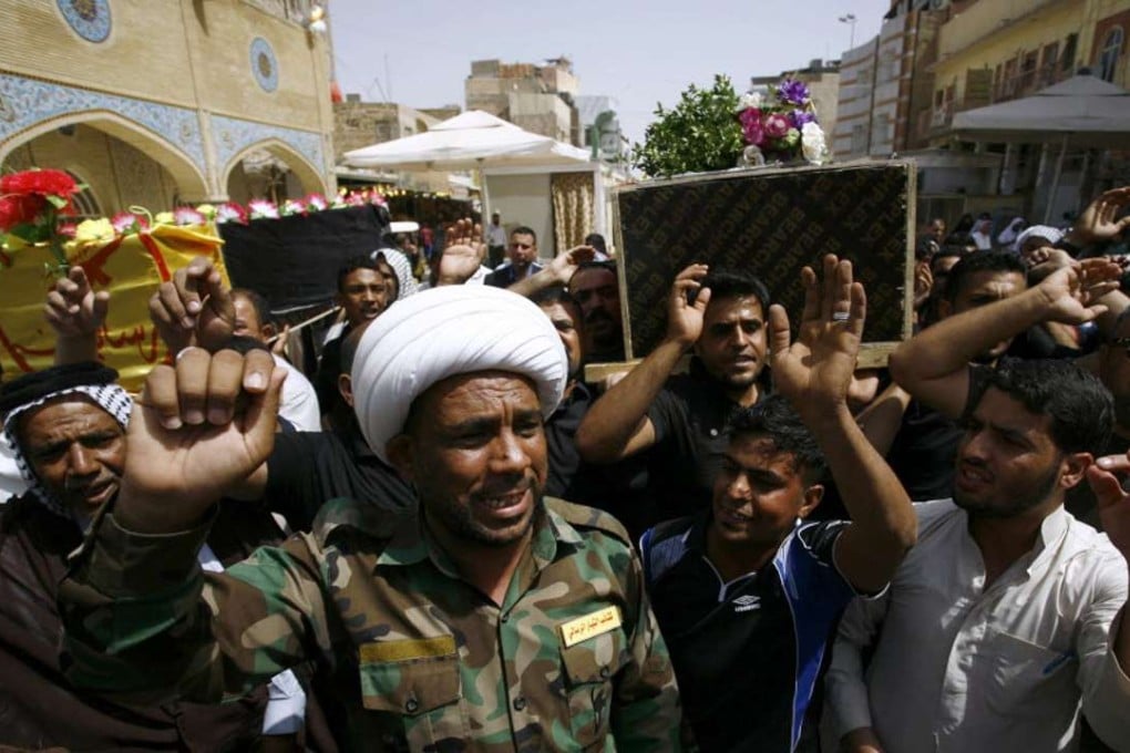Mourners carry coffins of men who were killed trying to retake Fallujah from Islamic State jihadists. Photo: AFP