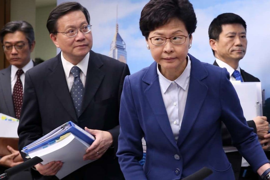(From the left) Director of housing Stanley Ying, Secretary for Transport and Housing Anthony Cheung, Chief Secretary Carrie Lam and director of water supplies Enoch Lam attend a press conference on the commission of inquiry’s report. Photo: Sam Tsang