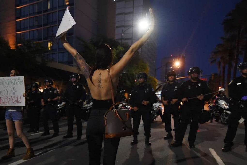 Anti-Trump protesters demonstrate outside the convention centre. Photo: AFP