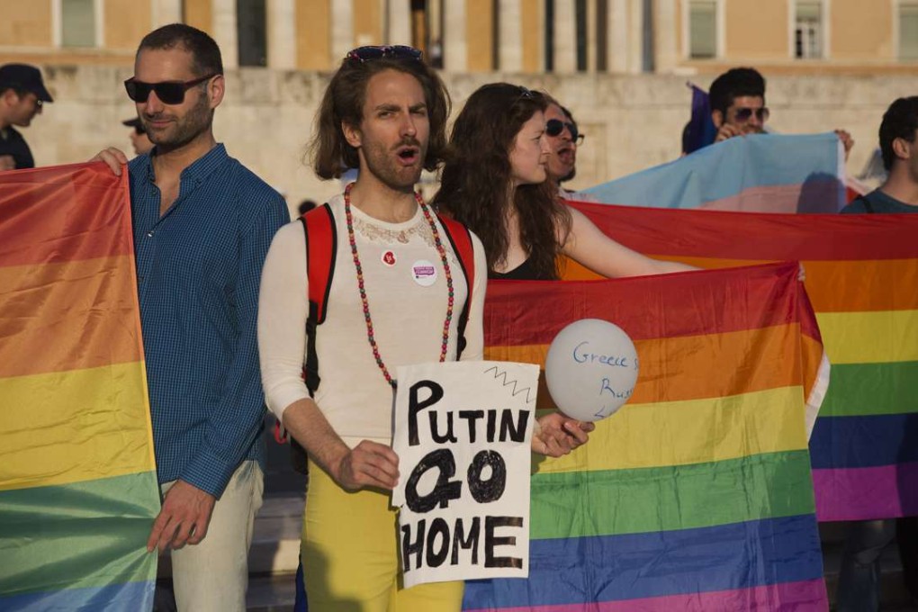 Protesters from a Greek gay and lesbian rights group gather in front of parliament, to protest a visit by Russian President Vladimir Putin, on May 27, 2016. The protesters said violence against gays in Russia is still largely unpunished by authorities. Photo: AP