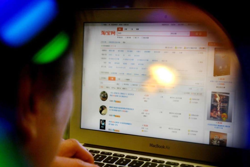 A man browsing DVDs for sale on Taobao.