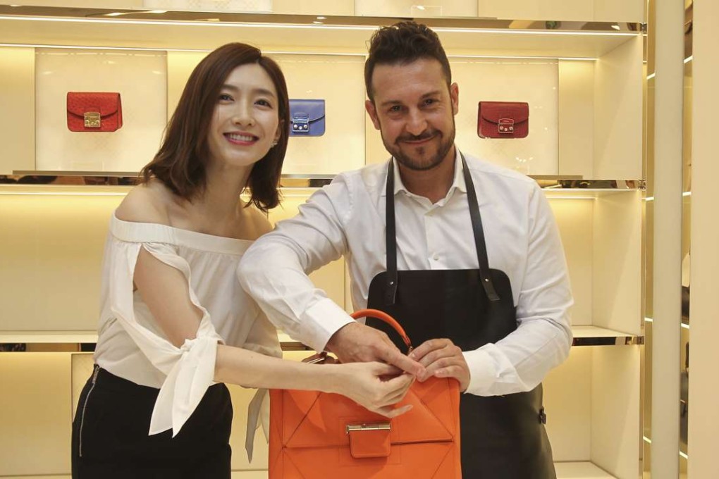 Chinese actress Jiang Shu-ying and Cristian Marcucci, a Furla artisan, with a Made For You Artesia bag. The initiative allows Furla to offer a luxury experience at a much lower price.