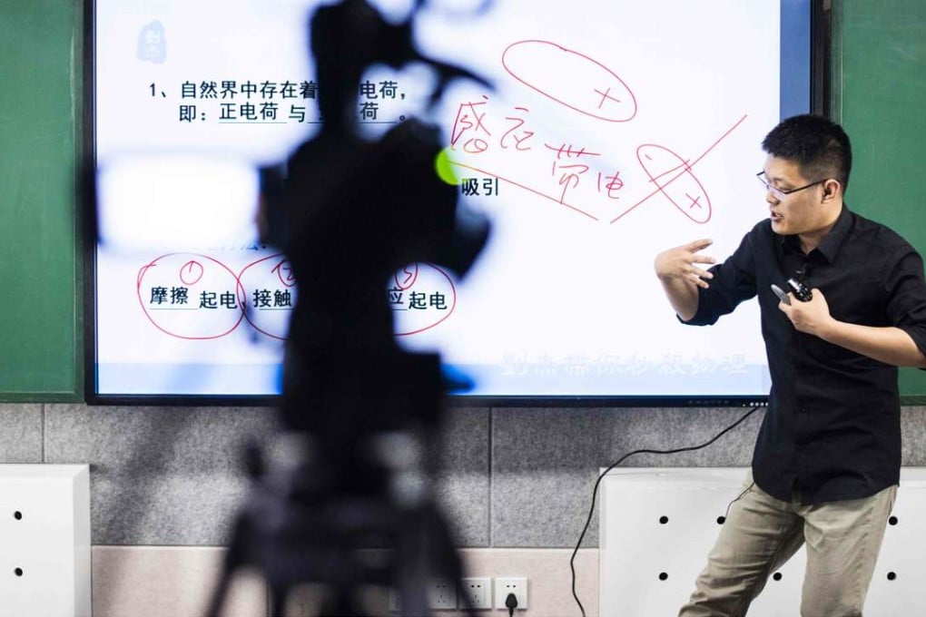 Liu Jie records an online physics lesson in Beijing. Photo: AFP