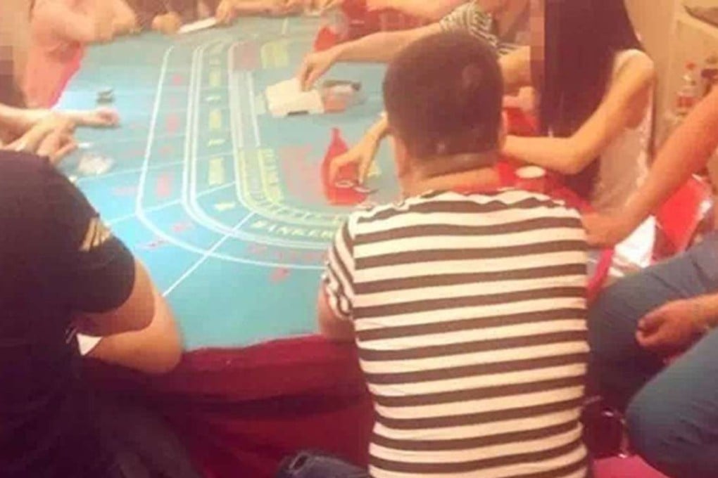 Gamblers playing at the illegal poker den. Photo: The Beijing News