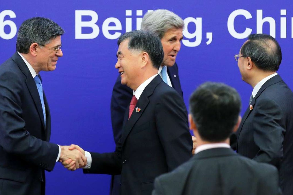US Treasury Secretary Jack Lew (left), US Secretary of State John Kerry (centre back), China’s Vice-Premier Wang Yang (centre front) and China’s State Councillor Yang Jiechi greet each other after the closing ceremony of the US-China Strategic and Economic Dialogue in Beijing. Photo: Reuters