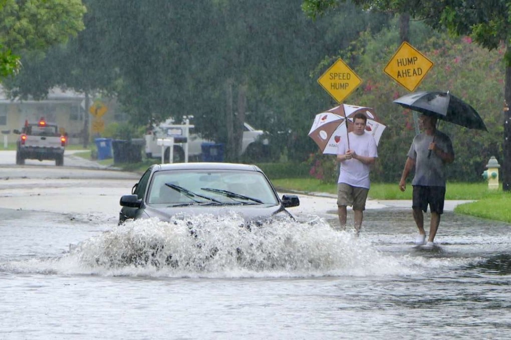 A motorist drives down a flooded street in St Petersburg, Florida, after Tropical Storm Colin dumped heavy rains over the Tampa Bay area Tuesday. Photo: AP