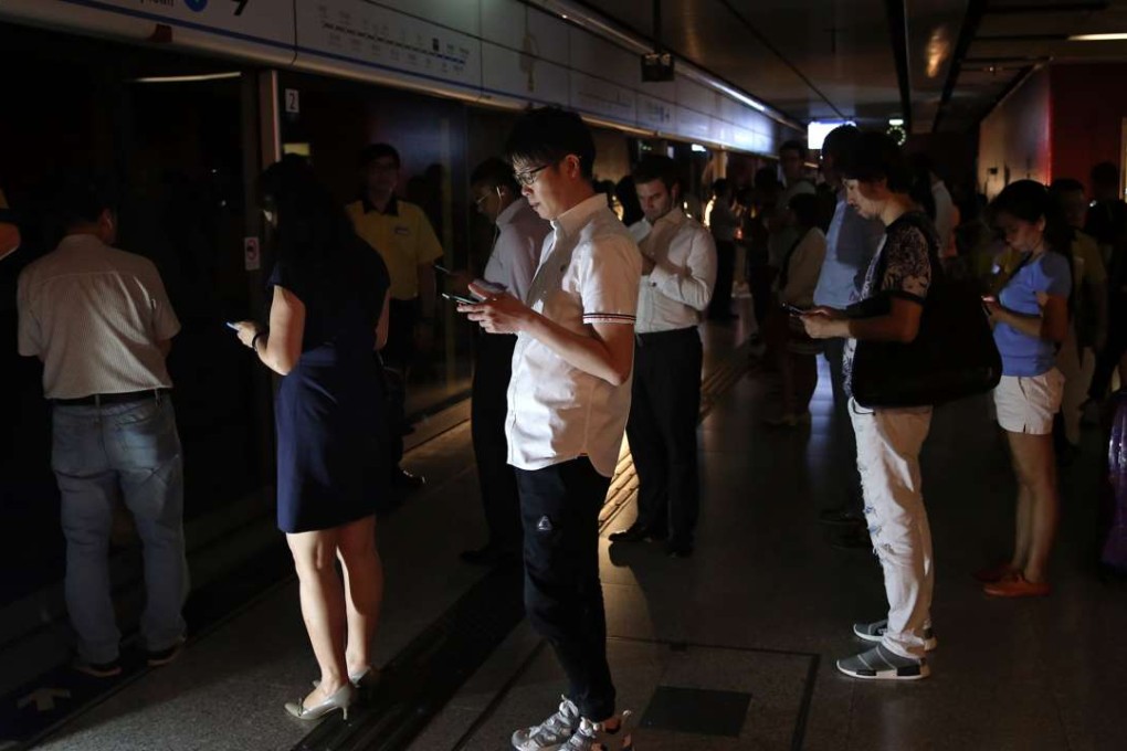 The lobby of the Central station is lit up only by backup lighting during a power failure in the afternoon. Photo: Sam Tsang