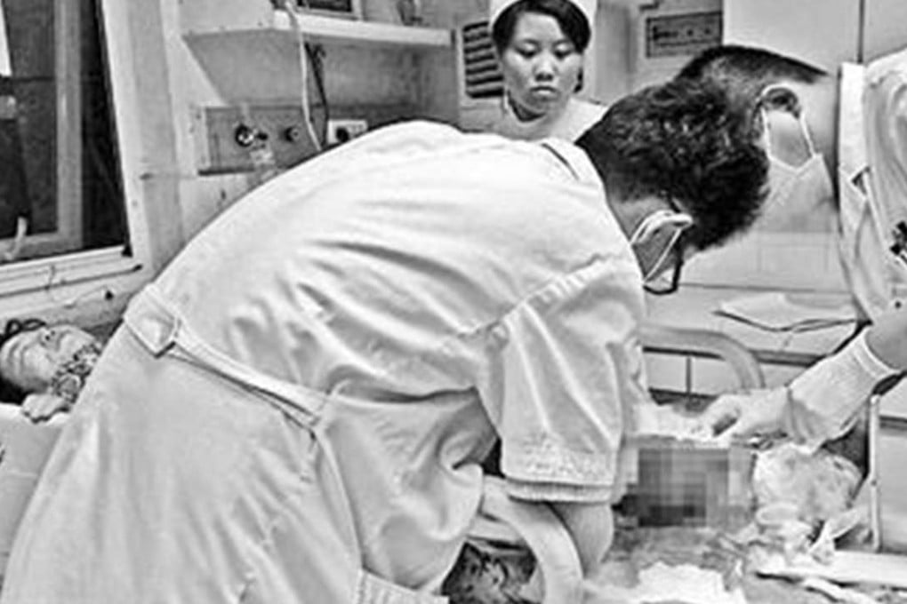 Medical staff treat the injuries of the severely injured woman at a Beijing hospital. Photo: SCMP Pictures