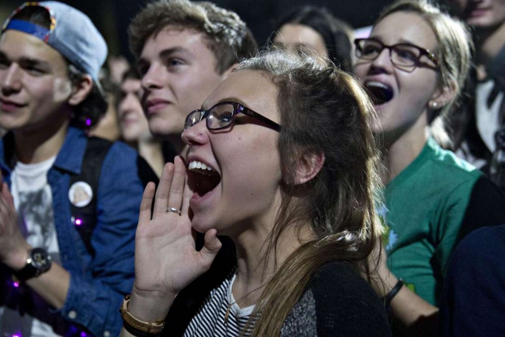 Young supporters of US Democratic presidential candidate Bernie Sanders cheer as he leaves the stage during a campaign rally at the University of Iowa Field House in Iowa City. Photo: Bloomberg