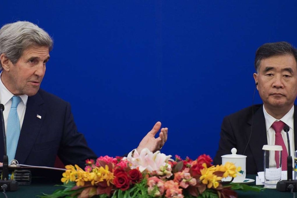 US Secretary of State John Kerry, left, alongside Vice-Premier Wang Yang during a closing statements of the US-China Strategic and Economic Dialogue in Beijing on Tuesday. Photo: AP