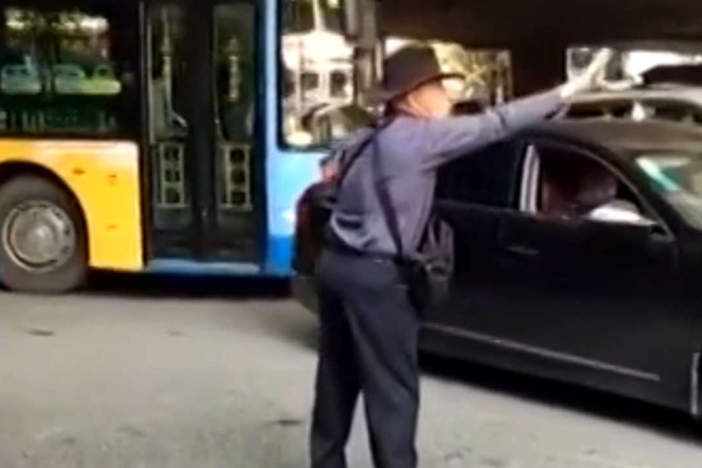 New Zealander ‘Bruce’ directs traffic at a busy intersection in Guiyang, Guizhou province. Photo: SCMP Pictures