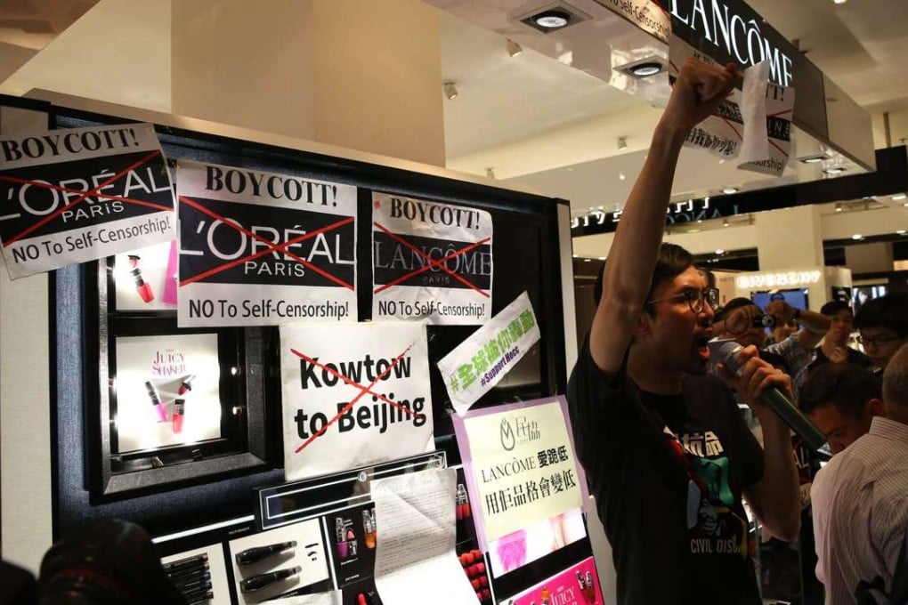 Protesters outside a Lancome booth in Times Square. Photo: Sam Tsang