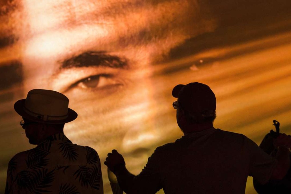 People watch a video at the Muhammad Ali Centre on the first of two days of funeral ceremonies bidding farewell to the legendary boxer. Photo: AFP