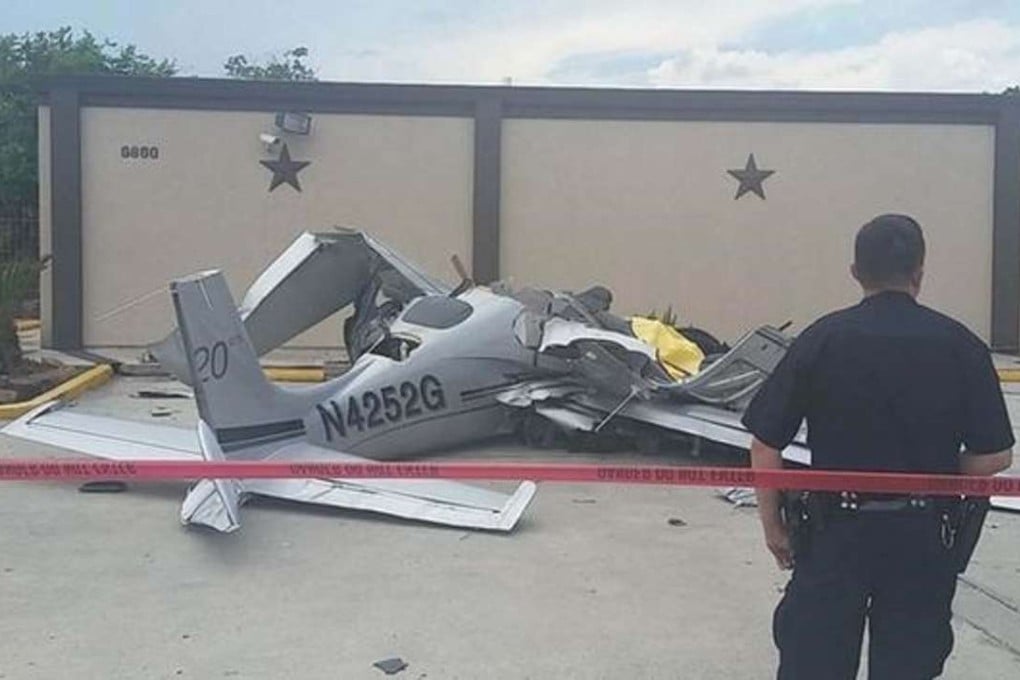 The mangled wreckage of a light plane that smashed into a parked car, near the Hobby Airport in Houston. Photo: ABC 13 News