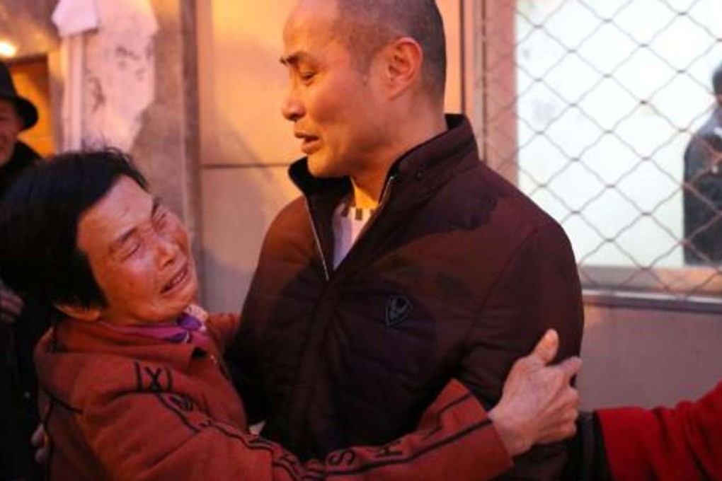 Xu Yuseng (right) is embraced by his mother in February after being freed when a court ruled he and three others convicted of murder in 1999 were all innocent. Photo: ThePaper.cn