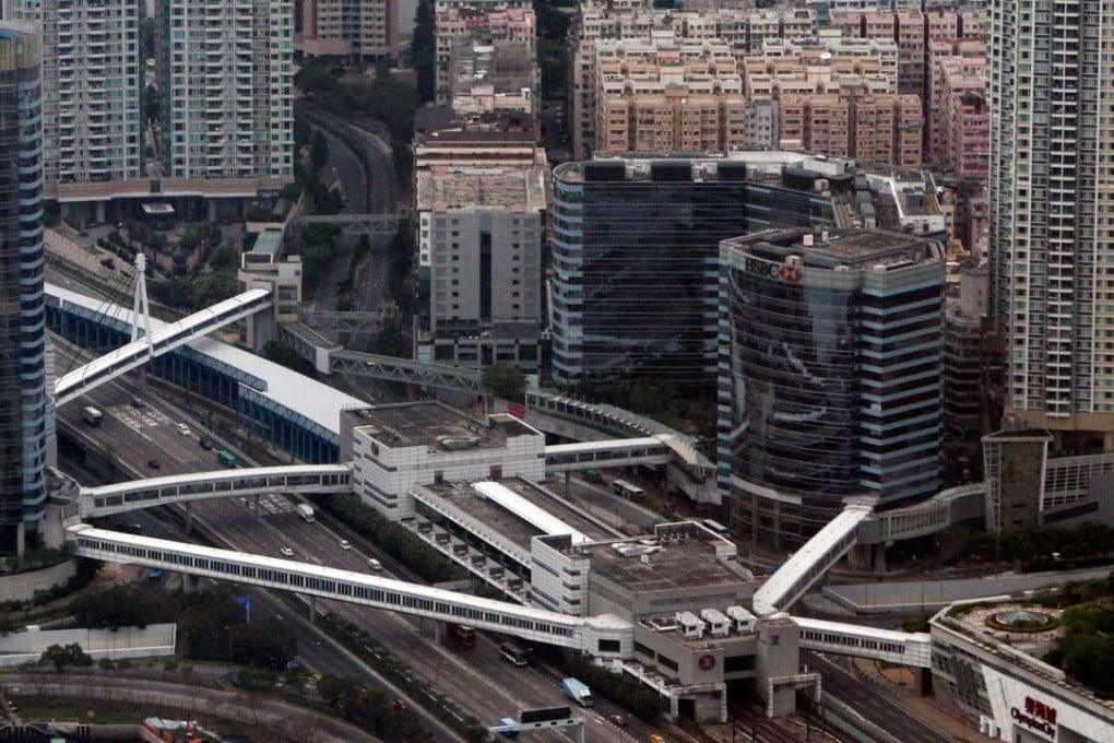A cluster of interconnected residential complexes, including The Long Beach development, surrounds Olympic MTR station. General view of Olympic MTR station, West Kowloon. 03MAY11