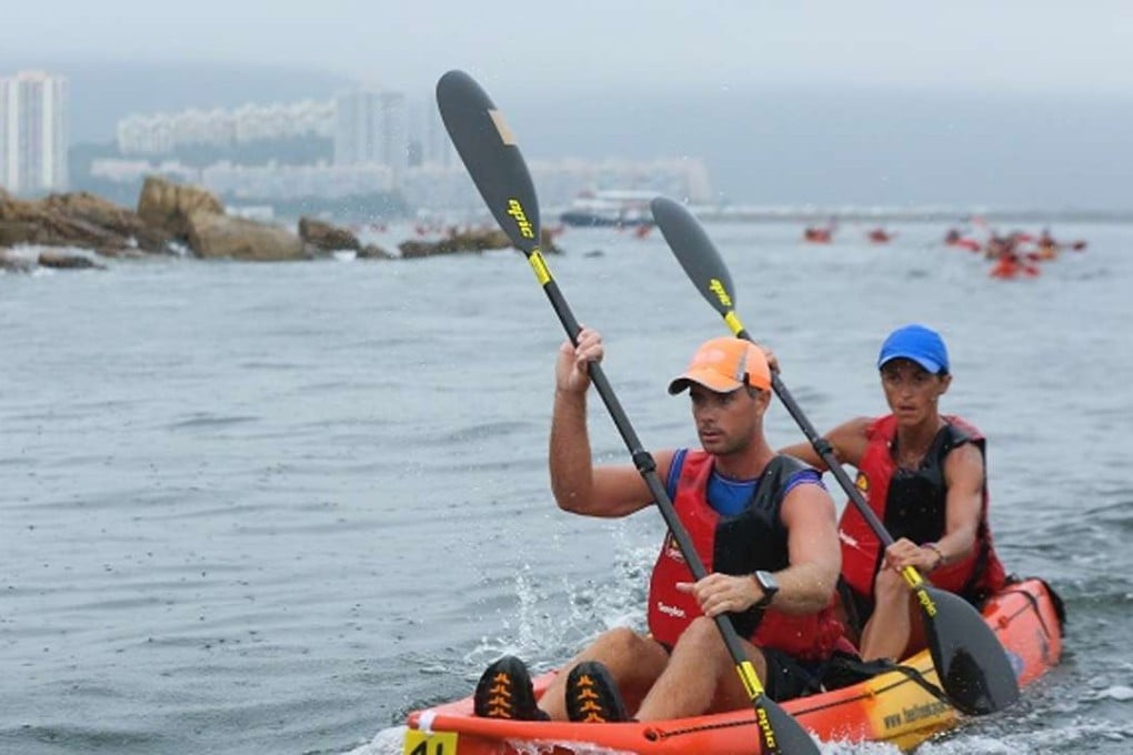 Iwona Gancarz and Andrew Watts on their way to victory in the mixed race in the second round of the Kayak n Run at Discovery Bay. Photo: SCMP Pictures
