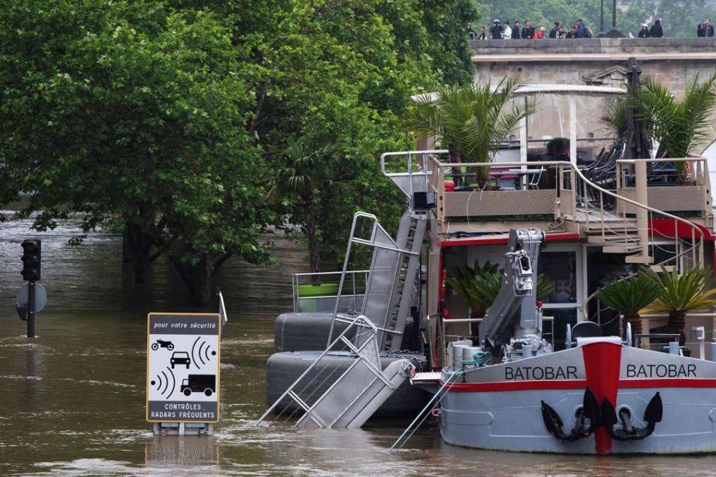 A boat is docked in the flooded Seine River in Paris. Photo: AFP