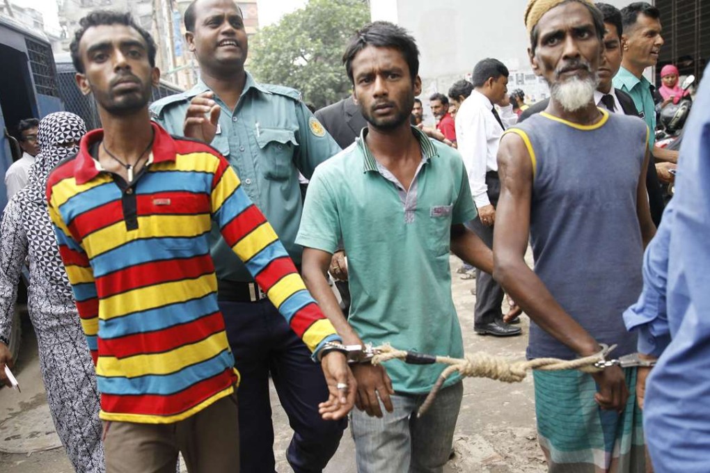 Bangladeshi police escort arrested men in Dhaka on June 12, 2016, who were detained during a anti-militant crackdown across the country. Photo: AFP