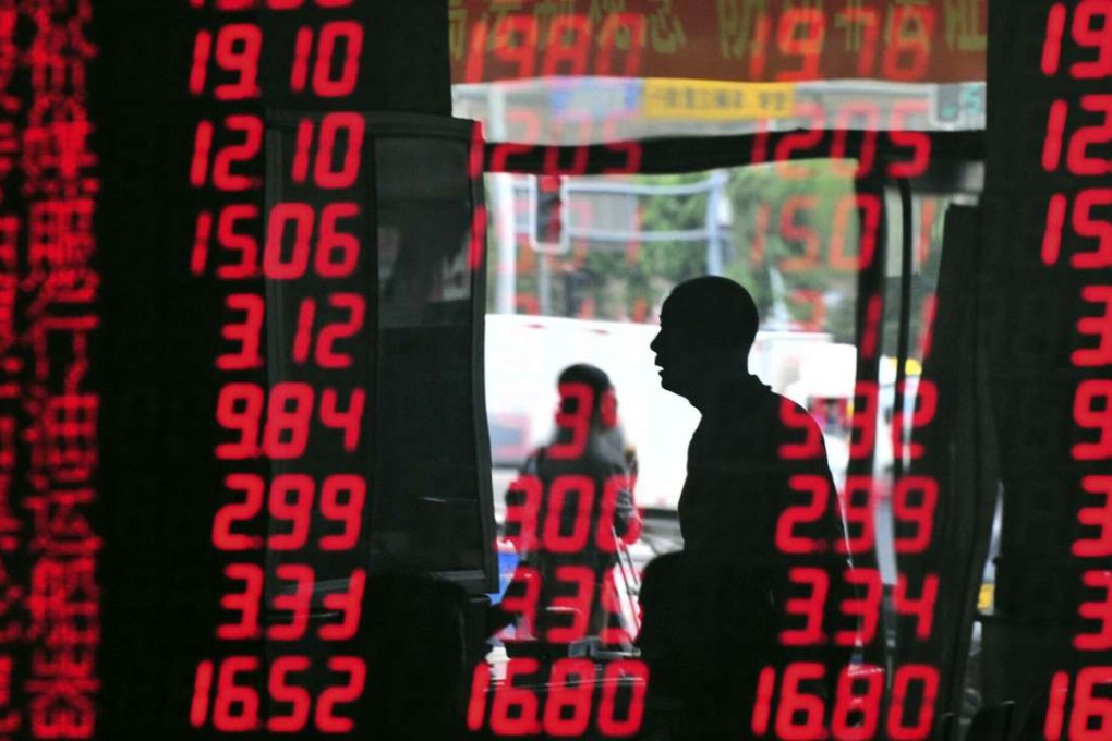 A brokerage house in Shenyang, Liaoning province. Interest in China’s onshore bond market by overseas investors is expected to rise as a result of increasing levels of clarity surrounding the rules of access. Photo: REUTERS/Stringer/Files