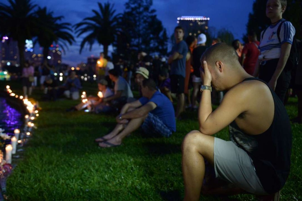 A man cries during a vigil to mourn the victims of the Orlando mass shooting at a park in the Florida city on Sunday evening. Photo: Xinhua