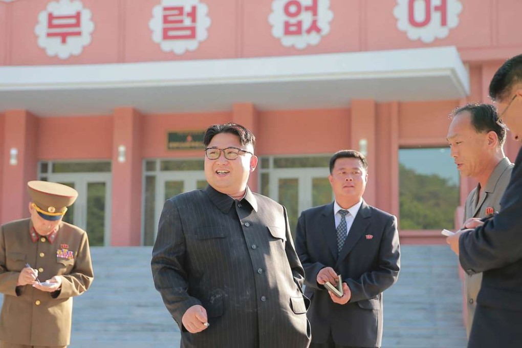 North Korean leader Kim Jong-un (centre). The hacking originated from an IP address traced to the North Korean capital and targeted network management software that is widely used by private companies and government agencies. Photo: AFP