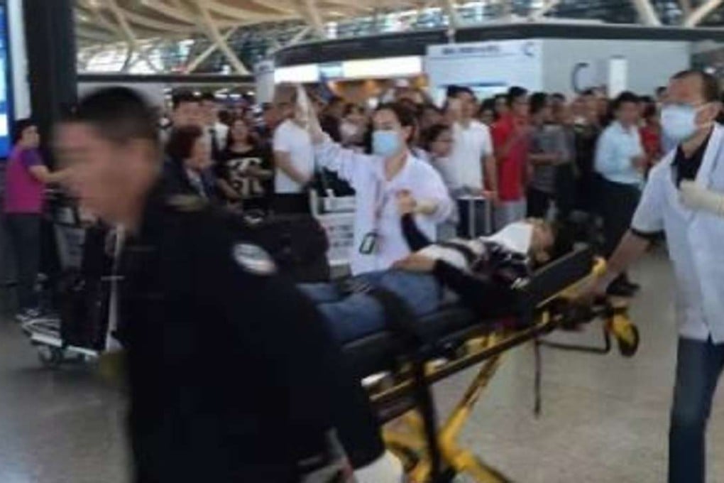 An online photo shows one of the four victims of the blast is rushed out of Passenger Terminal 2 at Shanghai Pudong Internationl Airport on Sunday afternoon. Photo: SCMP Pictures