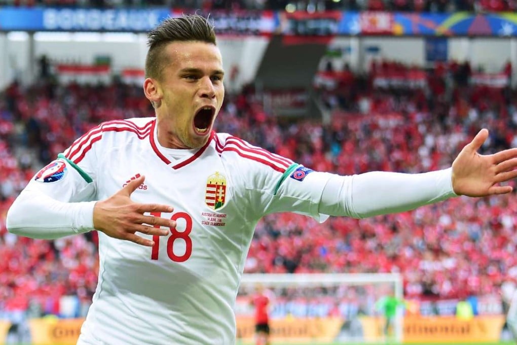 Hungary's midfielder Zoltan Stieber celebrates after scoring the second against Austria. AFP PHOTO / Attila KISBENEDEK