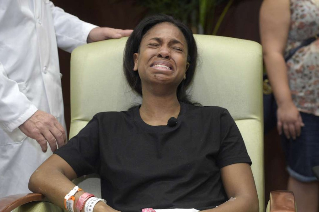 Patience Carter, a survivor of the Pulse nightclub shooting, sobs after telling her story during a news conference at Florida Hospital Orlando on Tuesday. Photo: AP