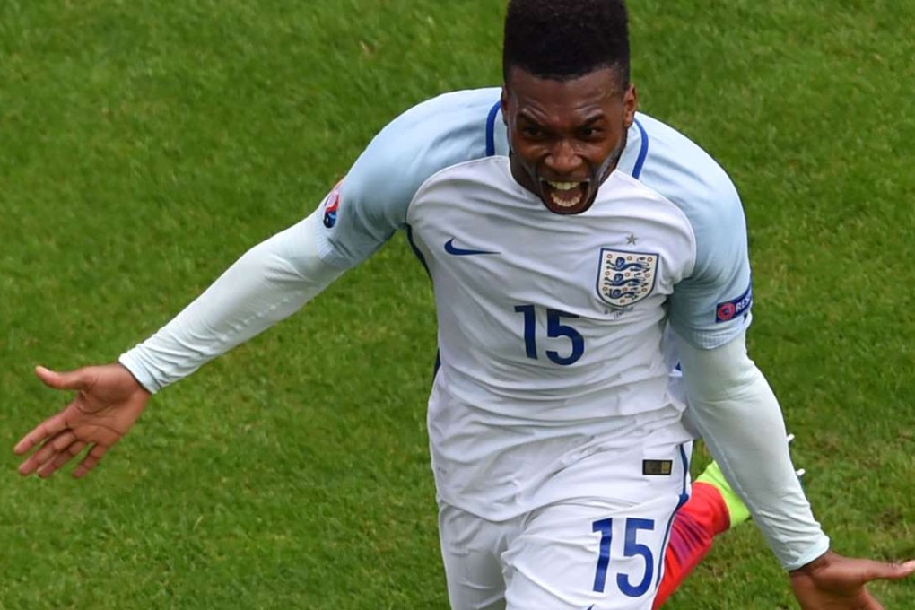 England's forward Daniel Sturridge celebrates afer scoring the winner. AFP PHOTO / PHILIPPE HUGUEN