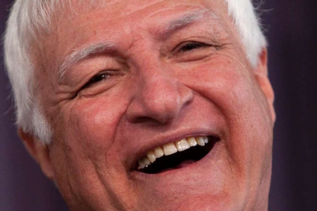 Australian MP Bob Katter has defended a campaign video showing him as a cowboy shooting two rival politicians. Photo: AFP