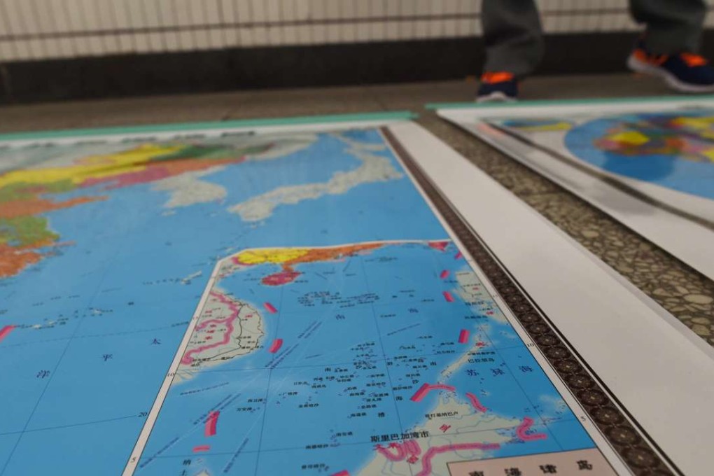 A map for sale in Beijing that includes an insert showing China’s claim in the South China Sea. Photo: AFP