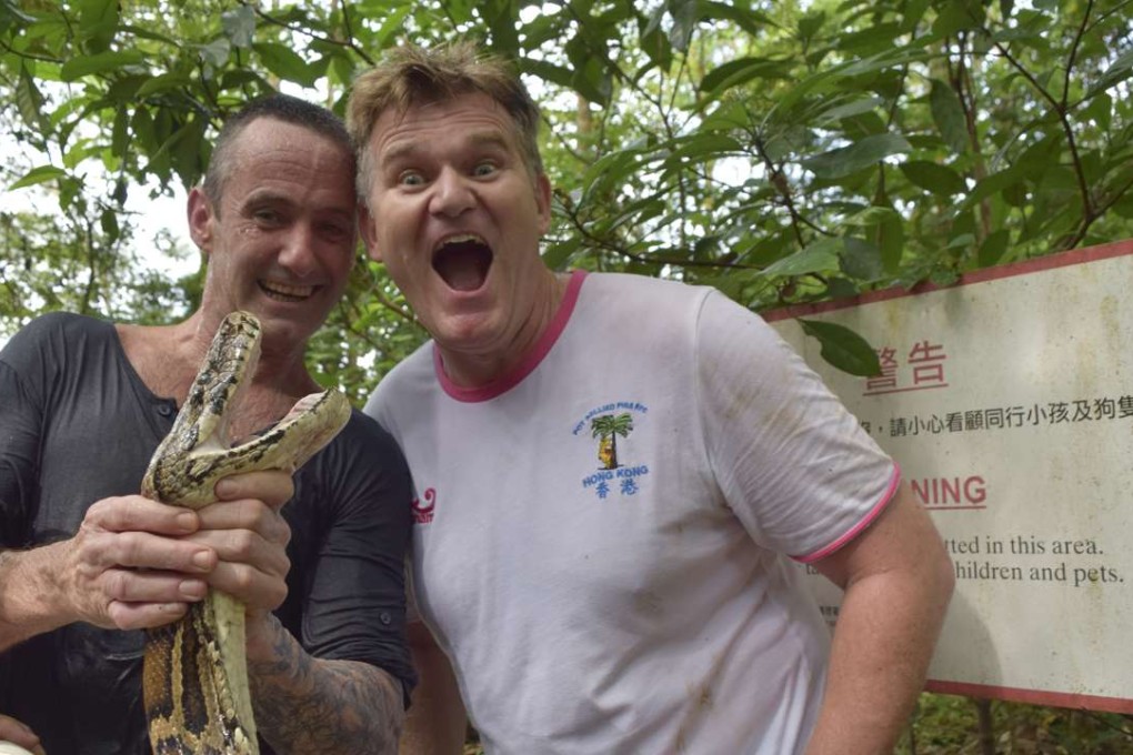 Karl Davies felt able to relax after Dave Willott (left) caught the Burmese python which had sunk its teeth into Davies’ leg two days earlier and tried to grip the 107kg Hong Kong resident in its coils. Photos: Red Door News