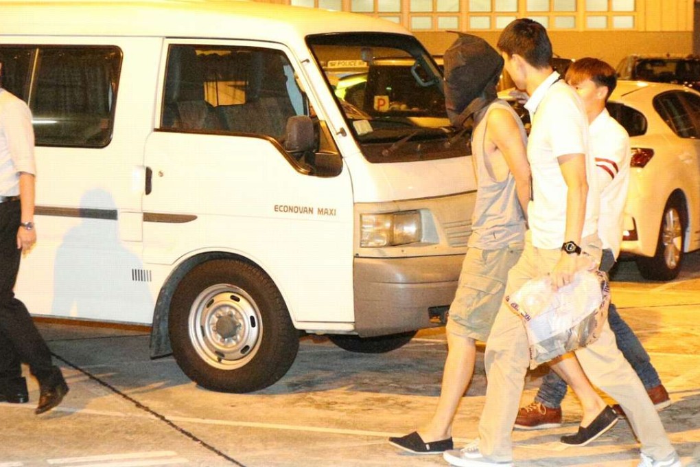 The suspect is taken to Hung Hom police station. Photo: SCMP Pictures