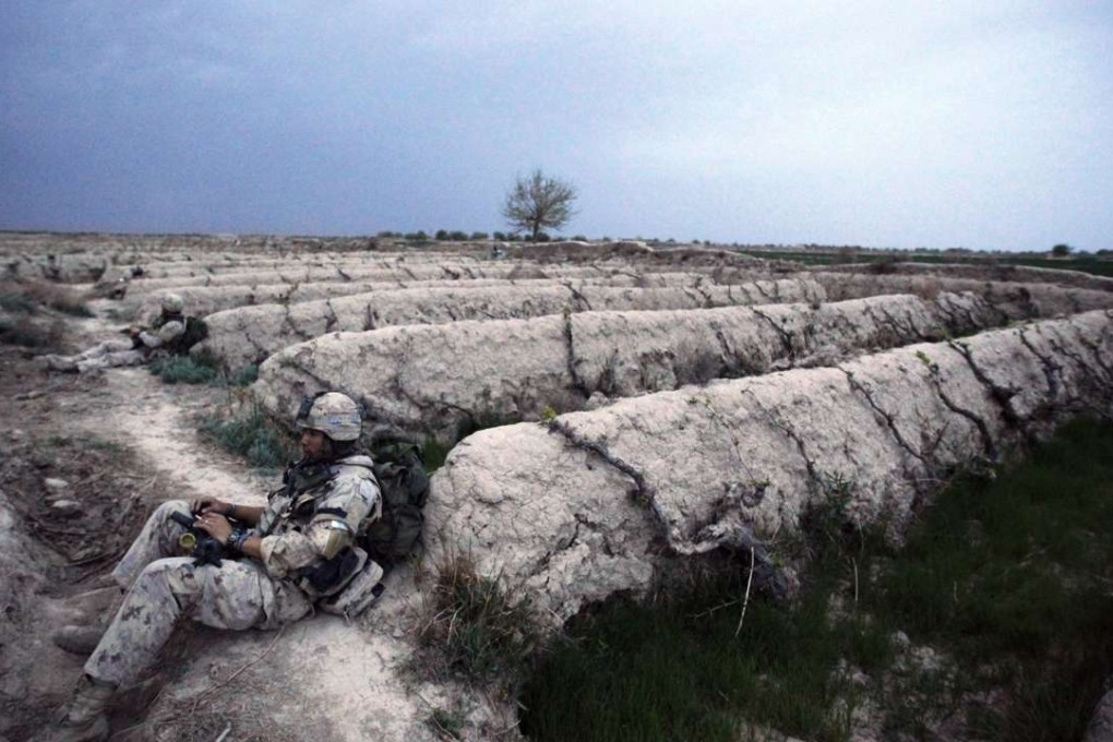 Canadian soldier of the NATO-led coalition rest after a night foot patrol during a mission in the Taliban stronghold of Zhari district in Kandahar province, southern Afghanistan, in 2009. Photo: Reuters
