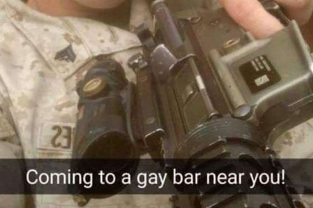 A US Marine poses with an assault rifle and the caption “Coming to a gay bar near you!”. The posting was reported to military authorities who are investigating. Photo: Facebook