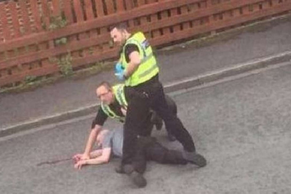 A man identified as Thomas Mair is arrested by British police outside his home in Birstall near Leeds in a scene from video obtained by ITV. Photo: ITV