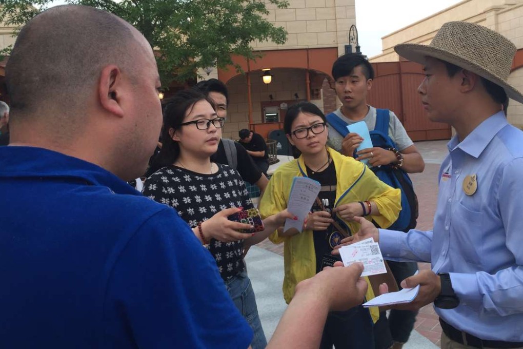 Unhappy visitors demand refunds at Shanghai Disneyland on Friday after several rides broke down. Photo: Alice Yan