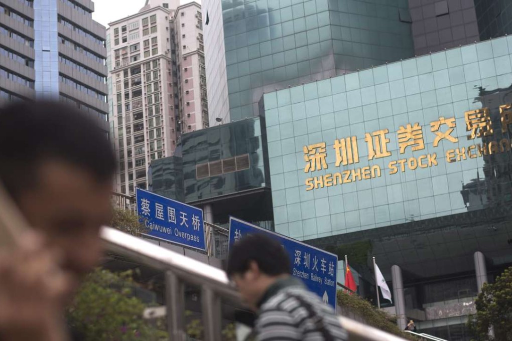 Shenzhen-Hong Kong Stock Connect may allow investors to trade on both bourses under a quota system. Photo: EPA epa05202350 People walk past the Shenzhen stock exchange in Shenzhen, Guangdong Province, China, 09 March 2016. According to the outline of the 13th five-year plan, China’s average annual rate of growth will slow from 7.8 per cent in the past five years to around 6.5 per cent, and per capita disposable income will also fall, from 7.7 per cent to around 6.5 per cent. EPA/FREDDY CHAN
