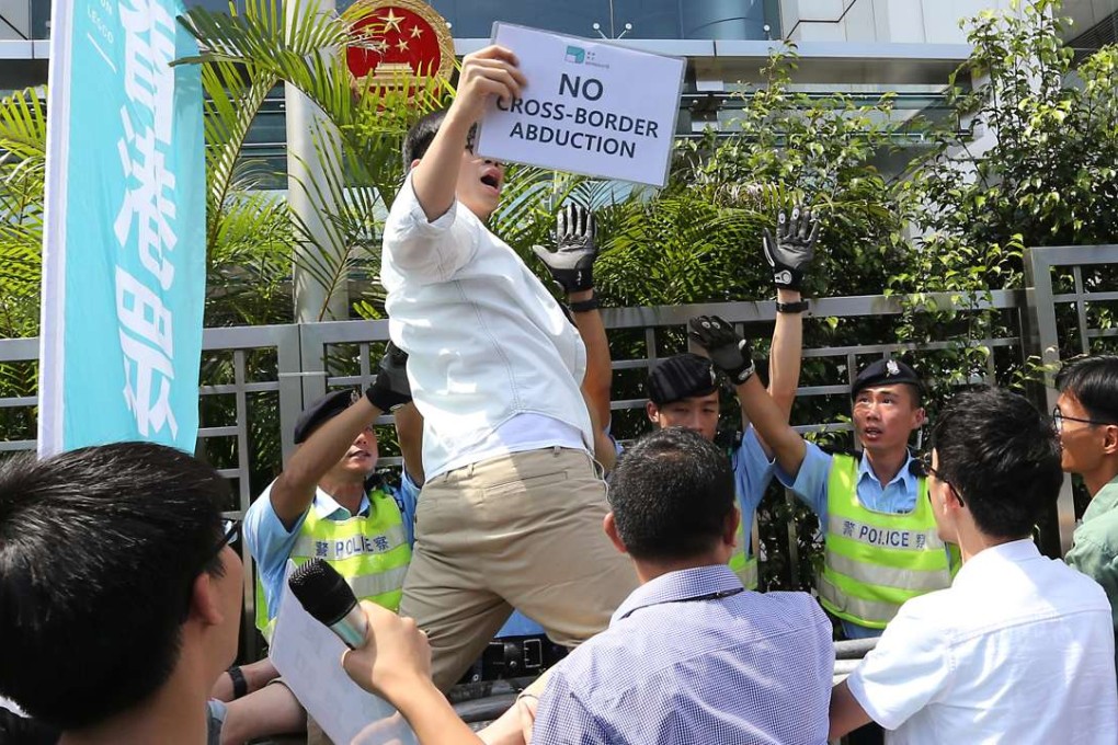 Demosisto members protest outside Beijing’s liaison office in support of Lam Wing-kee. Photo: Felix Wong