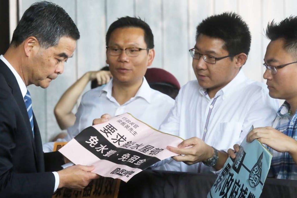 Hong Kong Chief Executive Leung Chun-ying receives a petition at the Central Government Offices in Tamar. Leung should reach out not just to the pro-establishment parties but also to pan-democrats. Photo: Dickson Lee