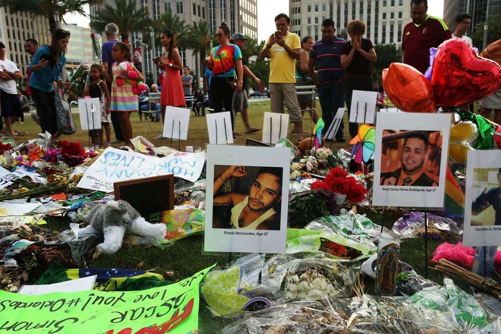 People visit a memorial for those killed at the Pulse nightclub in Orlando, Florida. Photo: AFP