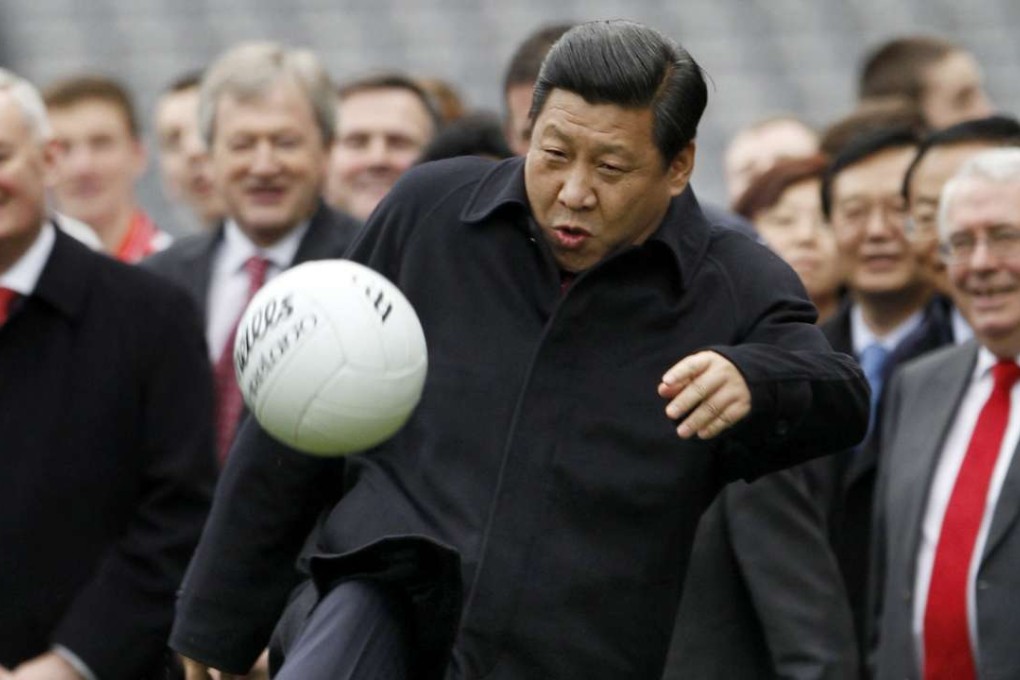 Xi Jinping kicks a football at Croke Park in Dublin, Ireland during a visit in February 19, 2012. Photo: Reuters