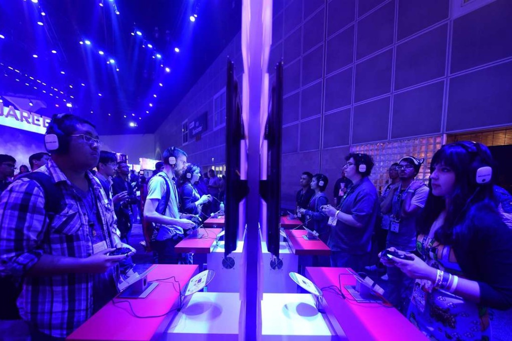 Gaming fans play Kingdom Hearts 2.8 on PS4 at E3. Photo: AFP